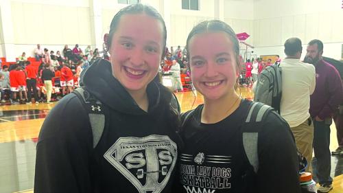 Allie Uzzell, left, and her sister Abbie Uzzell, right, after Tuesday’s game. Photo by Jeff Wick