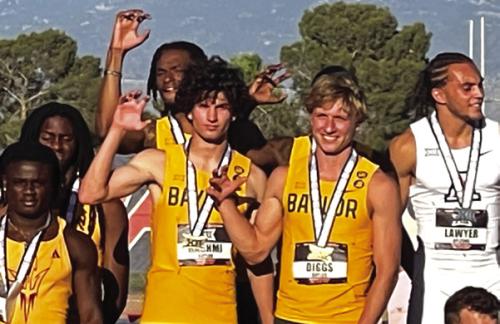 Austen Diggs, second from right, at the Big 12 championships.