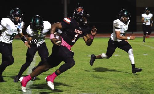 Schulenburg’s Daterrion Houston runs past several Bloomington tacklers in Friday’s game. Photo by Audrey Kristynik