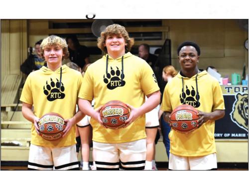 Photo by Paul Kipp The Round Top-Carmine boys basketball team held senior night activities for the team’s three seniors last Tuesday. They are shown here, left to right: Cody Wunderlich, Kash Wessels and Tre Fischer.