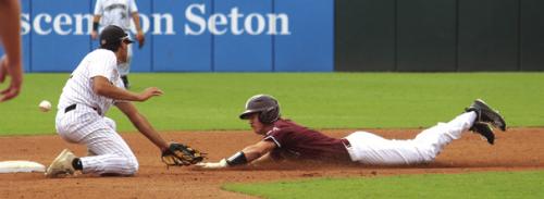 Lawson Fritsch steals a base in the title game. Photo by Jeff Wick