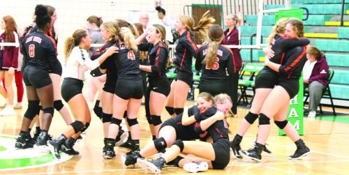 The members of the Schulenburg volleyball team storm the court for hugs all around after the final point of the regional title match Saturday in Brenham. Photos by Audrey Kristynik