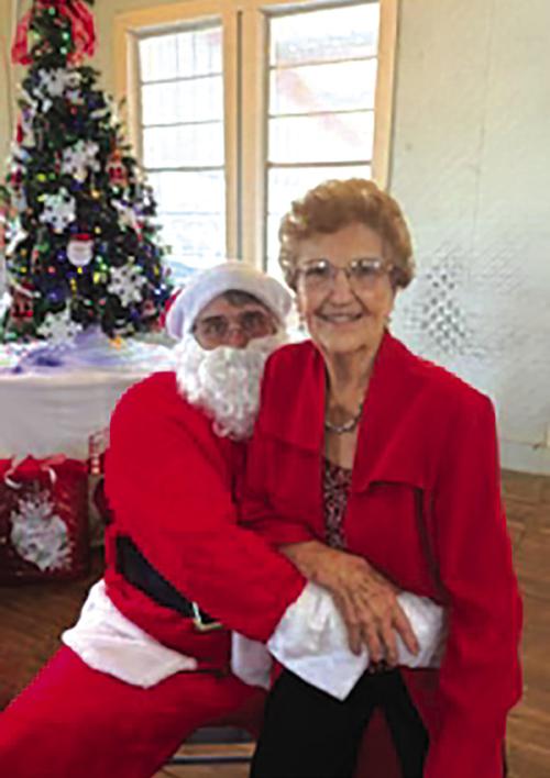 Oldest Attendee at Stavinoha Family Christmas Reunion Sits in Santa’s Lap