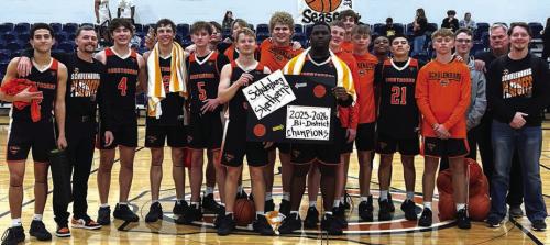 The Schulenburg boys basketball team celebrates their win Tuesday in Caldwell.
