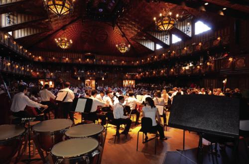 Young musicians prepare for concert on the Festival Institute stage.