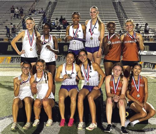 The members of the La Grange 4x400 relay pose atop the medal stand after winning their race Thursday on Giddings. The members of that relay are Diamond McKenzie, Kylie Trlicek, Landri Hernandez and Macie Collier.