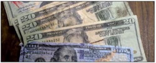 The fake bills pictured above were passed at several local businesses. These bills look like real money at first glance. But they are obviously fake upon closer inspection. They feature the words “Motion Picture Use” and “Motion Picture Copy Money” printed prominently on the bills. Photo by Andy Behlen