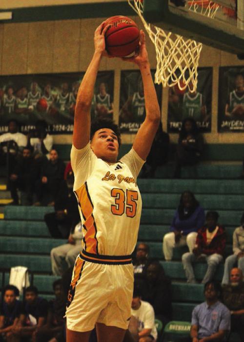 Above: La Grange’s Brandon Mathis goes up for a dunk in the first quarter Monday. Below: La Grange’s Cordale Knapik, shown here shooting, scored a team-high 17 points Monday. Photos by Jeff Wick