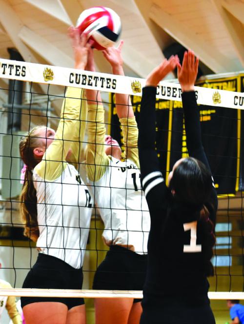Round Top-Carmine’s Madison Markwardt and Jessica Rohde join forces at the net in Tuesday’s victory over Fayetteville. Photo by Paul Kipp