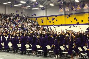 In front of a packed gym of well-wishers, the La Grange High School grads throw their caps skyward at the conclusion of Thursday’s ceremony. Photo by Jeff Wick