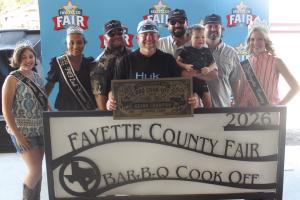 The team of Silver Bullet Cookers won Grand Champion at Saturday’s Fayette County Fair Bar-B-Q Cook Off. Left to right: Jr. Miss Fayette County Anabelle Zwahr, 2025 Queen second runnerup Keanna Henderson, Anthony Wessels, Trevor Erickson, head cook Brock Otto, Brant Otto, Charles Otto and 2025 Fair Queen Hailey Janish. Photos by Jeff Wick