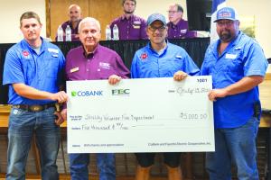 Shelby Volunteer Fire Department received $5,000 to assist with the purchase of a new pumper truck. Pictured from left to right are Shelby VFD Assistant Chief Blake Moehlmann; FEC Board President Joseph Kruppa; Shelby VFD firefighter Charles Atkins; and Shelby VFD firefighter Dennis Gaskins.