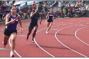 About 150 local kids are participating in the La Grange Optimist Club summer track program. Their first of four meets this month was Saturday in Columbus (above). Photo by Jeff Wick