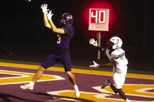 La Grange’s Rogan Mihatsch makes an interception in front of Navasota receiver Caysien Douglas Friday in the endzone. Photo by Jeff Wick