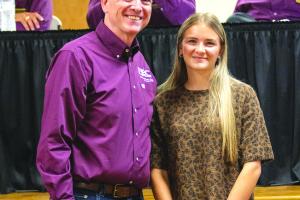 Sophie Vinklarek, right, received the cooperative’s Luck of the Draw Scholarship. She is pictured with FEC general manager and CEO, Doug Lambert.