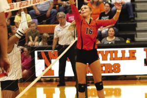 Schulenburg’s Jenna Guentert tips a ball over the net in Friday’s victory at Smithville. Photo by Audrey Kristynik