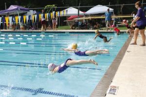 FAST youngsters jump into the pool during a recent race. Photo by Brittany Dawson