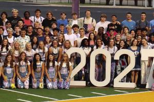 The members of the senior class of 2027 at La Grange High School gathered on the field for the Senior Sunrise event before the first day of school Wednesday. Photo by Lucy Carr