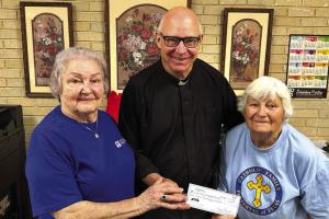 Members of Annunciation KJZT #41 of Ellinger donated a check for $675 to Father Steve Sauser from their annual fundraiser. President Gladys Polasek and Secretary Mary Vrazel did the presentation. Gladys is on the left in the picture, and Mary is on the right. The date of the donation was Tuesday September 22.