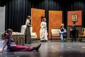 Fayette County Community Theatre student actors rehearse a scene from Little Women, which will be performed at the LGISD Performing Arts Center July 24-26. Pictured (from left) are Eden Nichols as Jo, Molly Hudson as Marmee, Sarita Kinsey as Meg, Jeremiah Lenhart as Laurie and Lou McCain as Old Mr. Laurence. Photo by Andy Behlen