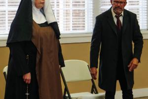 Kristen Holub as Prioress (left) and Aaron Rainey as Dr. Saul Weisman (right) rehearse their parts for Fayette County Community Theatre’s production of “Edith Stein.” Photo by Andy Behlen