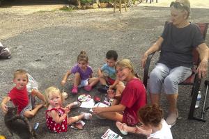 Local kiddos do an art project under the watchful eye of Tracy Svrcek.