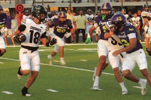 Giddings’ Colden Adams can’t find any running room as he is pursued by La Grange defensive players, left to right – Whitaker Samples, Luke Anderson, Chris Supak and Van Hill. Photo by Jeff Wick