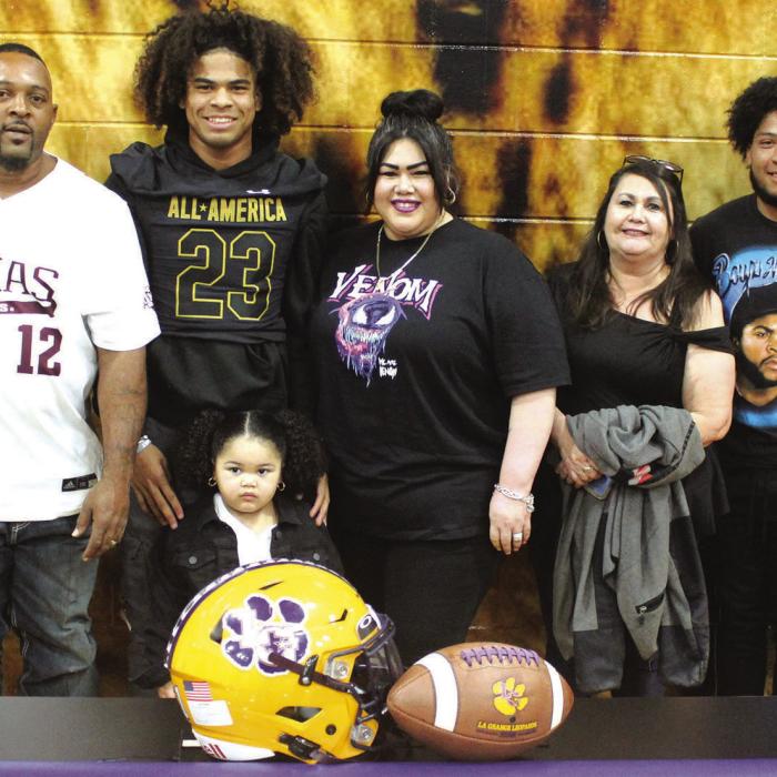 Several family members joined Bravion Rogers at the ceremony Friday honoring him for being selected to the Under Armour All-American Bowl game. From left to right – Saidee Yanis (his cousin), Jonathon Rogers (his father), Bravion Rogers, Sevyn Rogers (his sister), Miriam Rogers (his mother), Dorothy Yanis (his grandmother), Mason Rogers (his brother), Razario Rogers (his brother).