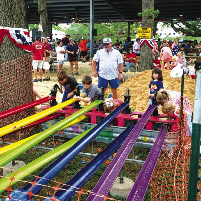 St. John Picnic offered lots of games for the kids, including this duck race. Photos by Andy Behlen