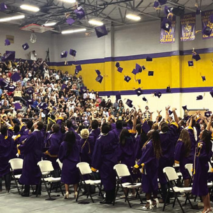 In front of a packed gym of well-wishers, the La Grange High School grads throw their caps skyward at the conclusion of Thursday’s ceremony. Photo by Jeff Wick