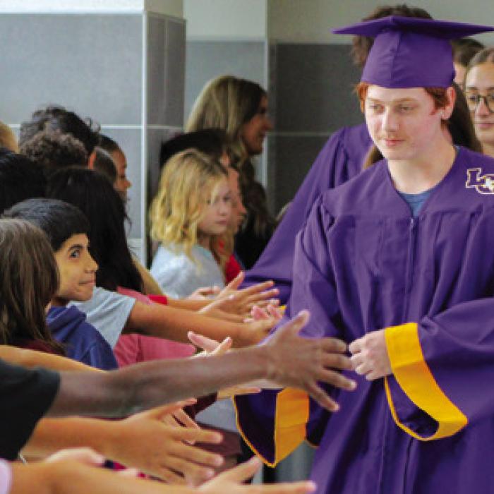 LHS seniors walked through the Elementary Wednesday, as younger students cheered. Photo by Meadow Taylor-Marklin
