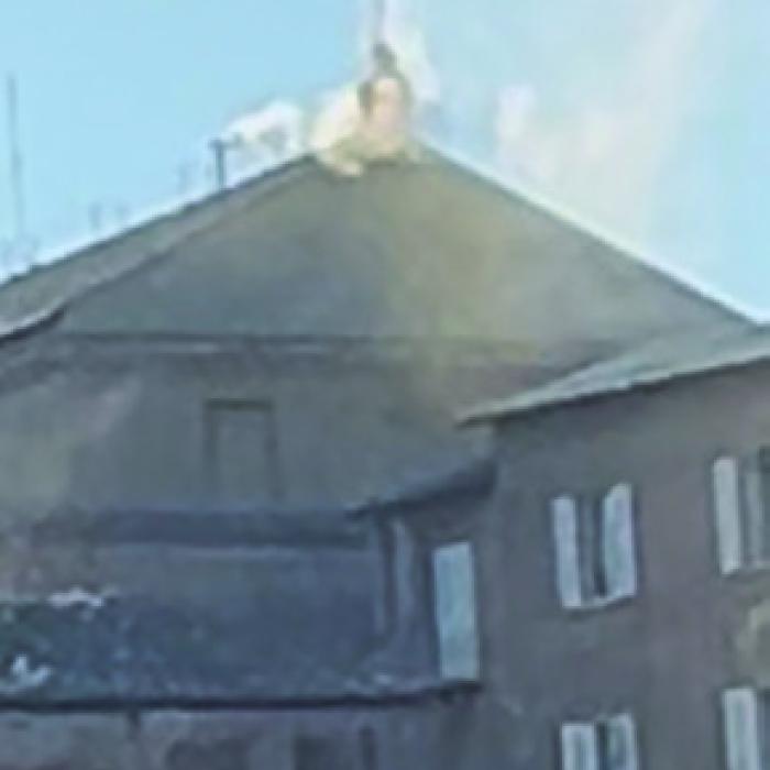 White smoke rises from the Sistine Chapel, signifying a new pope was selected. Photo by Sheila Brossmann