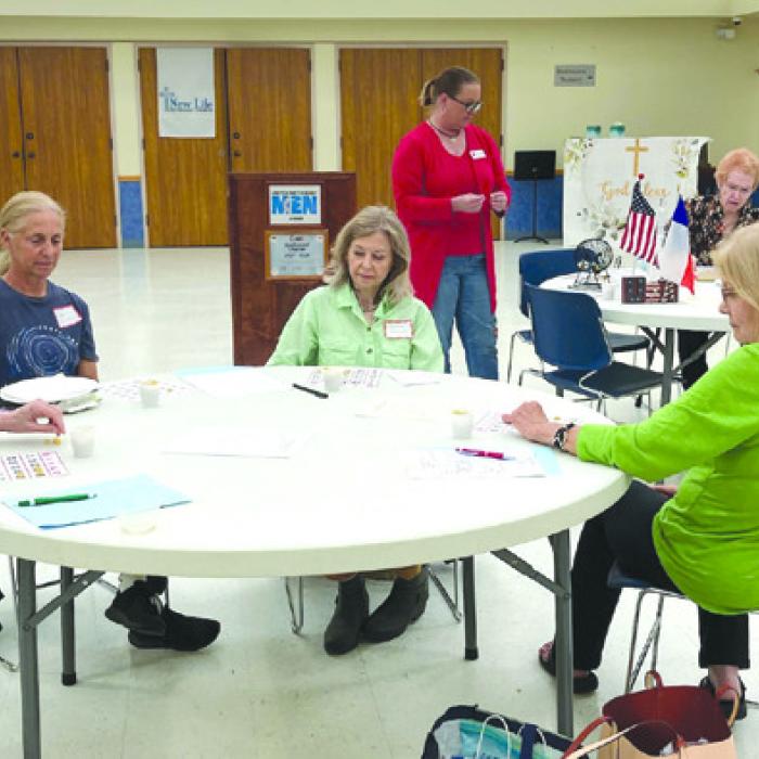 Fayette County retired teachers “studying” Bingo cards at May meeting.