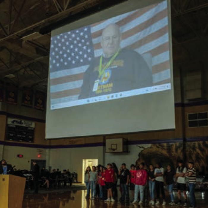 Students in Kim Newton’s technology class interviewed local veterans as part of a video production project that they screened during the Veterans Day program at La Grange High School Friday. Photo by Andy Behlen