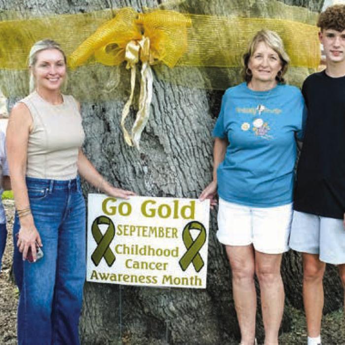 September Proclaimed Childhood Cancer Awareness Month/ Gold Ribbon Placed on Oak