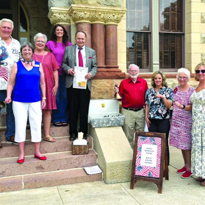 Pictured front from left on the courthouse steps is: Kathy Schatte, Constitution Week Chairman; second row: Jerry Schatte; Sherry Hebert, Chaplain; Cassie Austin; Judge Dan Mueller; beside the steps from left: Larry Jackson; Jamie Fabre; Carolyn Caflisch, Registrar; and Gina Minzenmeyer, Regent, Smith-McMillan Chapter, NSDAR.