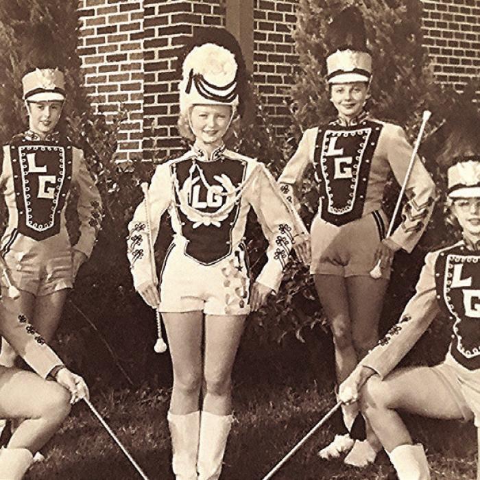 1955 La Grange Leopard band members (front row, left to right) are: Jean Foyt, drum major Virginia Mika Leech and Camille Freytag Roselius. (Back row, left to right): Elva Ann Meiners Keilers, Marilyn Jurajda Hart, Patsy Balzer Ott and Betty Mueller Schmidt.