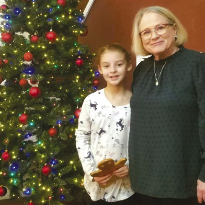 Coloring contest winner, Paisley Delgado receives award from WACA Board Secretary, Ellen Brumback.