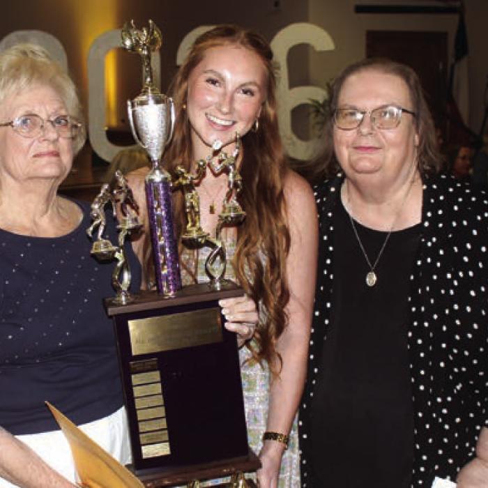 Ella Nygren, center, was the winner of the Business and Professional Women’s Female Athlete of the Year award. It was presented by Glenna Laffey, left, and Peggy Supak, right.