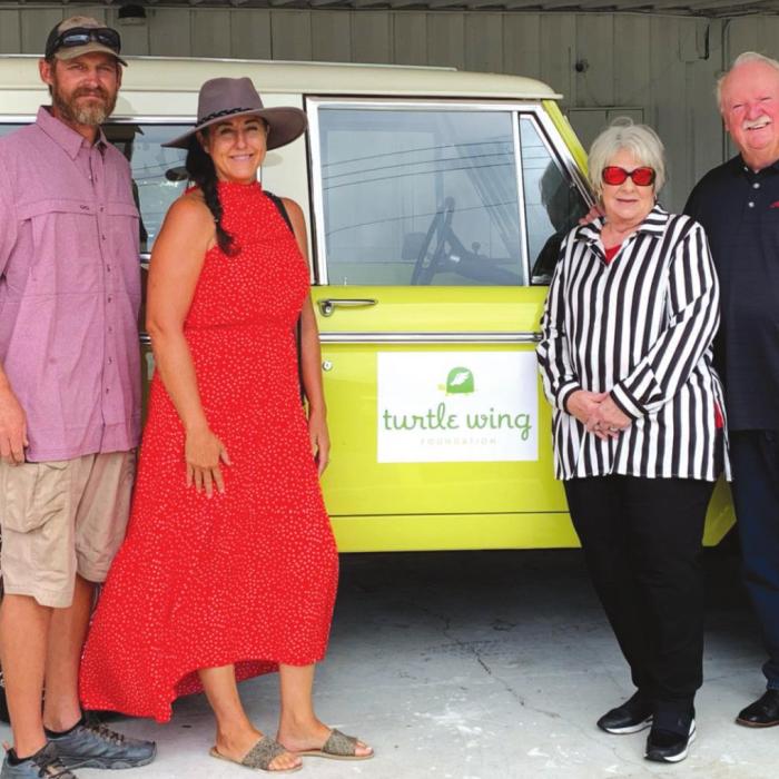 Pictured from left are: Andy Slater and Julie Shumney, winners, with Betty and John Burkland, donors.