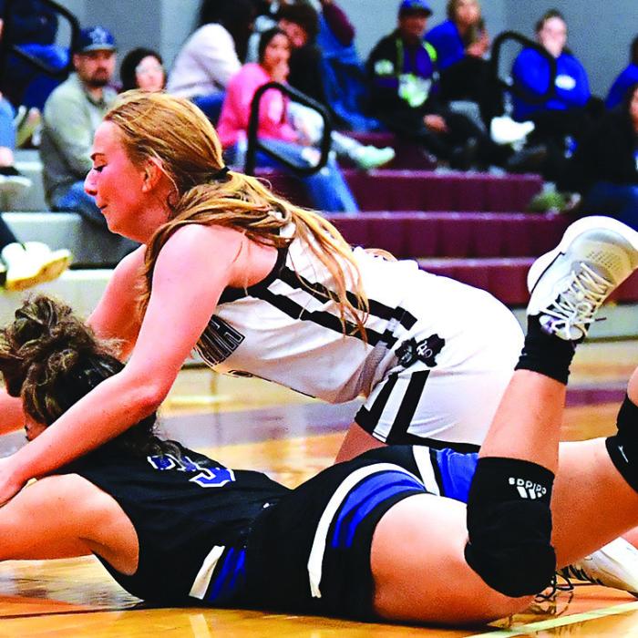 Flatonia’s Laurel Betak fights for possession of the ball in Tuesday night’s game against Yoakum. Flatonia lost 36-34. Photo by Stephanie Steinhauser