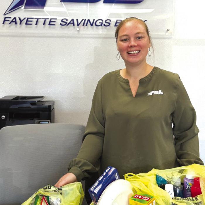 Brandi Rerich with Fayette Savings Bank donated bingo prizes for Senior Connections.