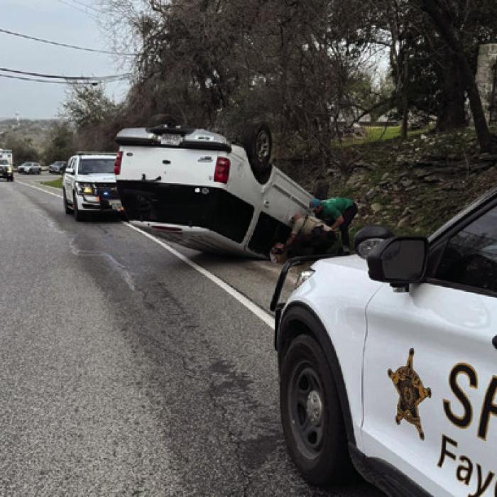 A white Ford SUV rolled over on the Bluff Friday morning, March 7. The driver was transported to South Austin Medical Center for treatment. Photo courtesy of the Fayette County Sheriff’s Office