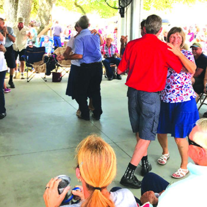 Dancing under the pavilion at the Dubina church picnic last year.