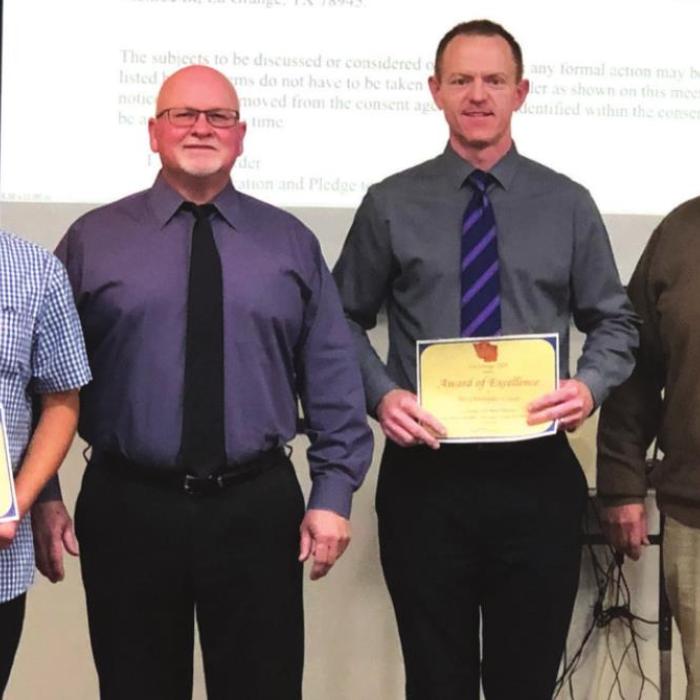 La Grange High School student Jose Estrada, left, was honored at Monday night’s meeting for his earning a place in the 2022 ATSSB All-State Band. Next to him, left to right are school board President Gary Drab, Band Director Christopher Cooper, and Superintendent Bill Wagner. Photo by Regina Keilers
