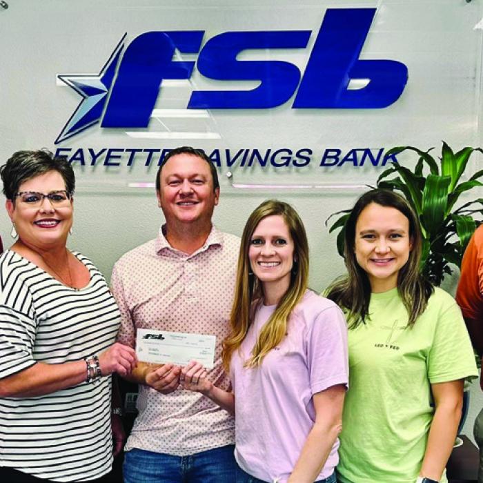 Fayette Savings Bank (FSB) presented a donation to a new local nonprofit, Led+Fed. The organization aims to share God’s love by feeding people. Pictured (from left) are Mike Olle and Cheryl Brossmann of FSB, Led + Fed Founders Nathan and Jenny Neiser, Led + Fed Board Member Alycia Konvicka, and Brad Tumis of FSB.