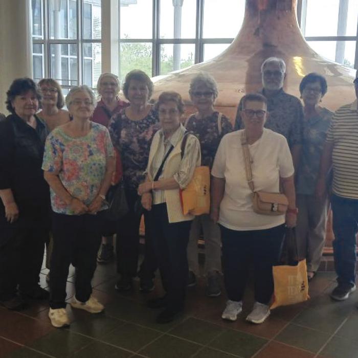 La Grange Senior Association members pictured in front of the original copper fermenters.