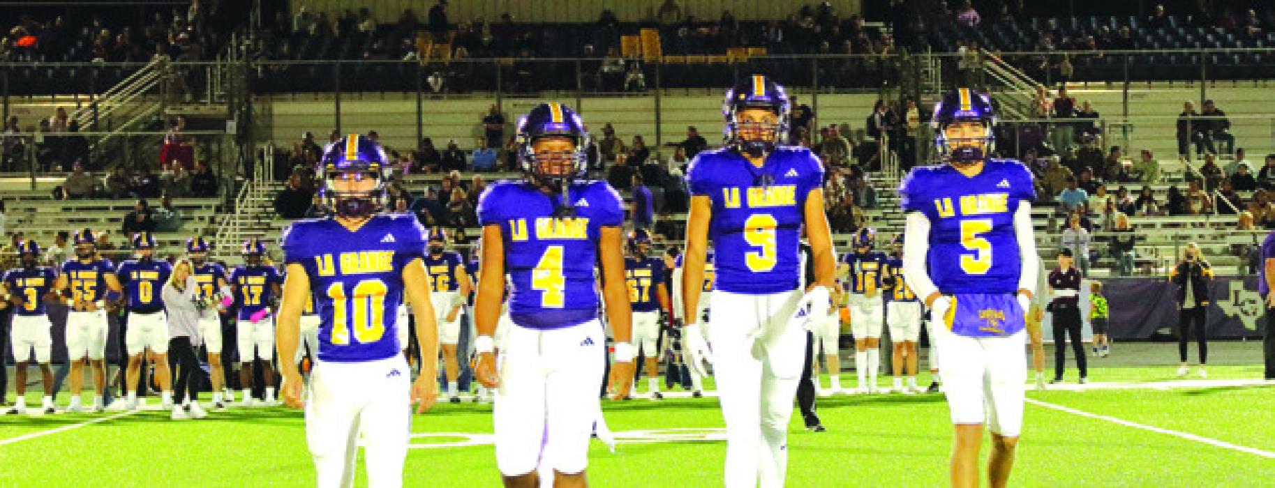 The La Grange captains walk out for the coin toss before Friday’s game. Photo by Darrell D. Gest