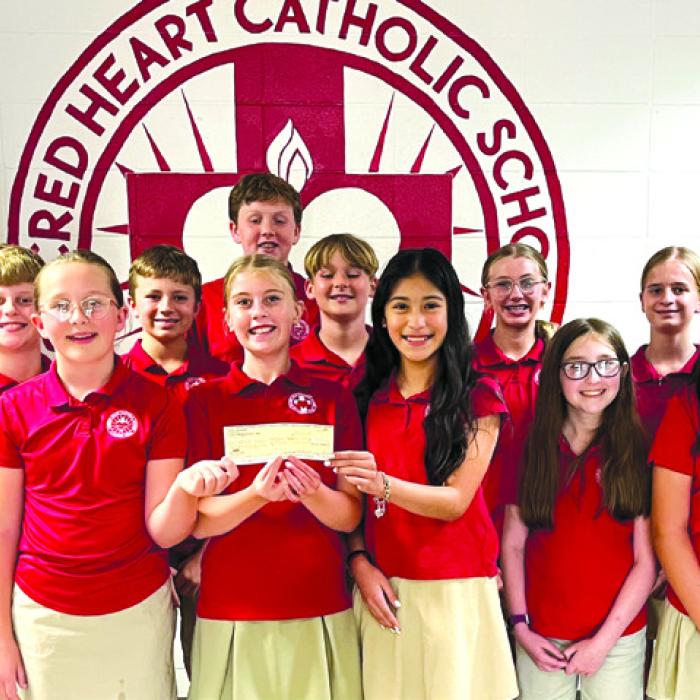 CDA No. 1962 recently made a donation toward the sixth grade end of year social at Sacred Heart School.