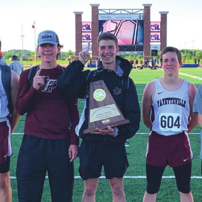 The Fayetteville boys shows off their regional team title trophy. Photo by Jennifer Jaeger